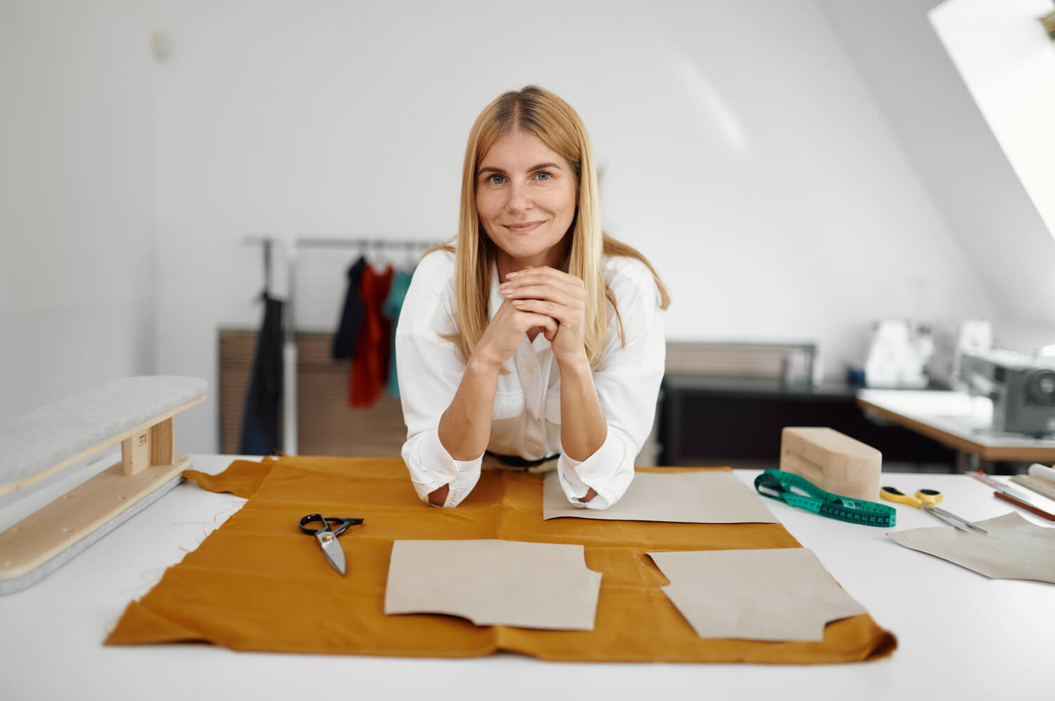 seamstress works with cloth pattern at workplace GENM3E5